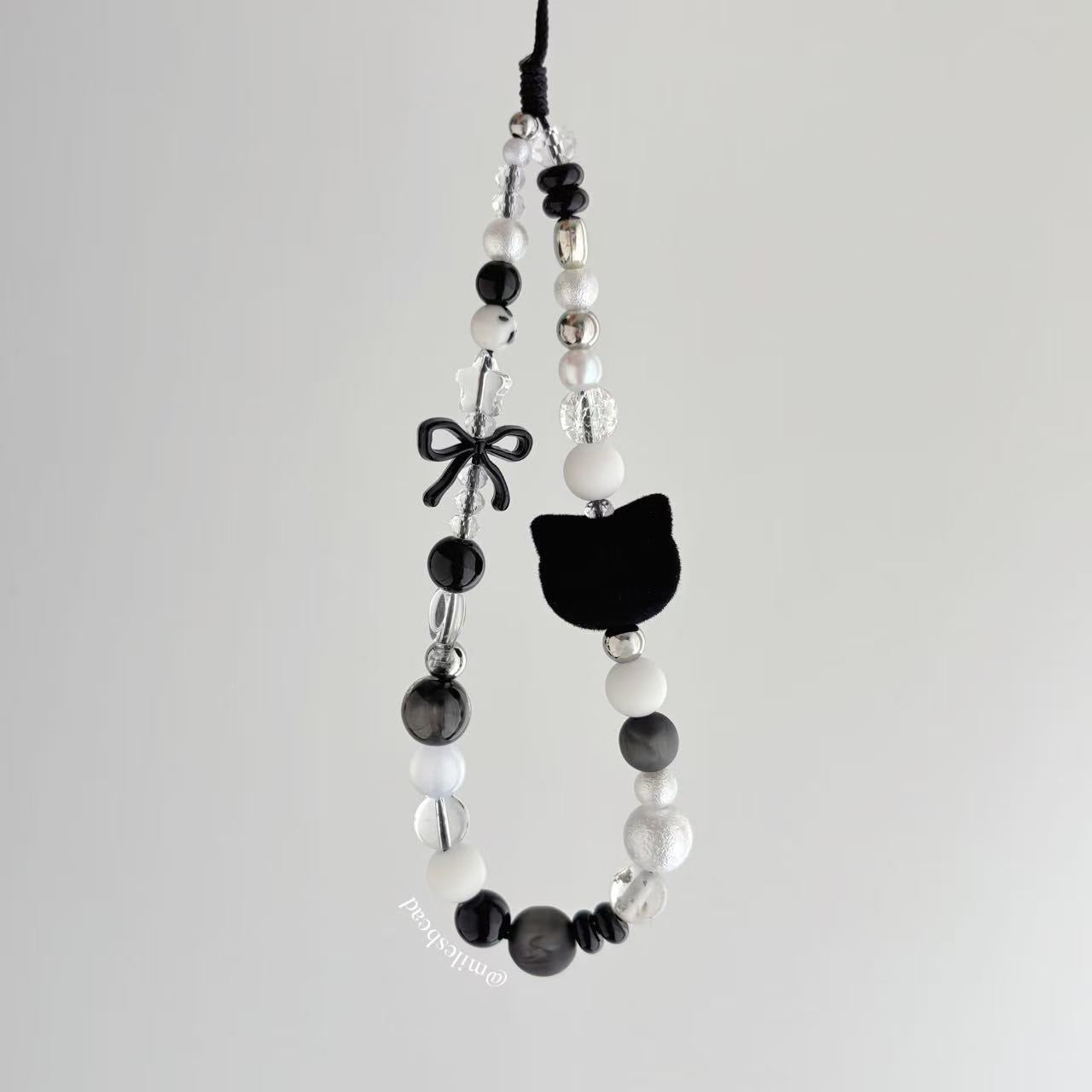 Black cat phone charm